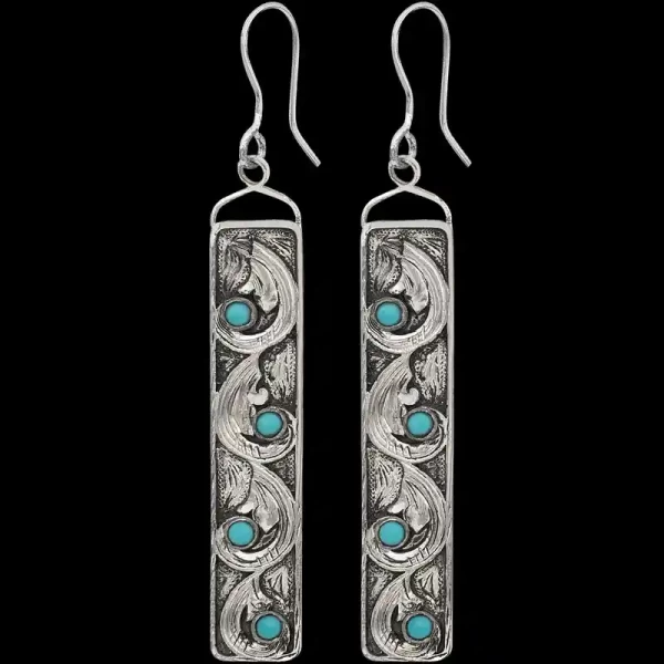Who doesn't love turquoise?! Our Magnolia Earrings are built on a fine German Silver Base with hand engraved scrolls and small turquoise stones for a classy Western charm. Order now!